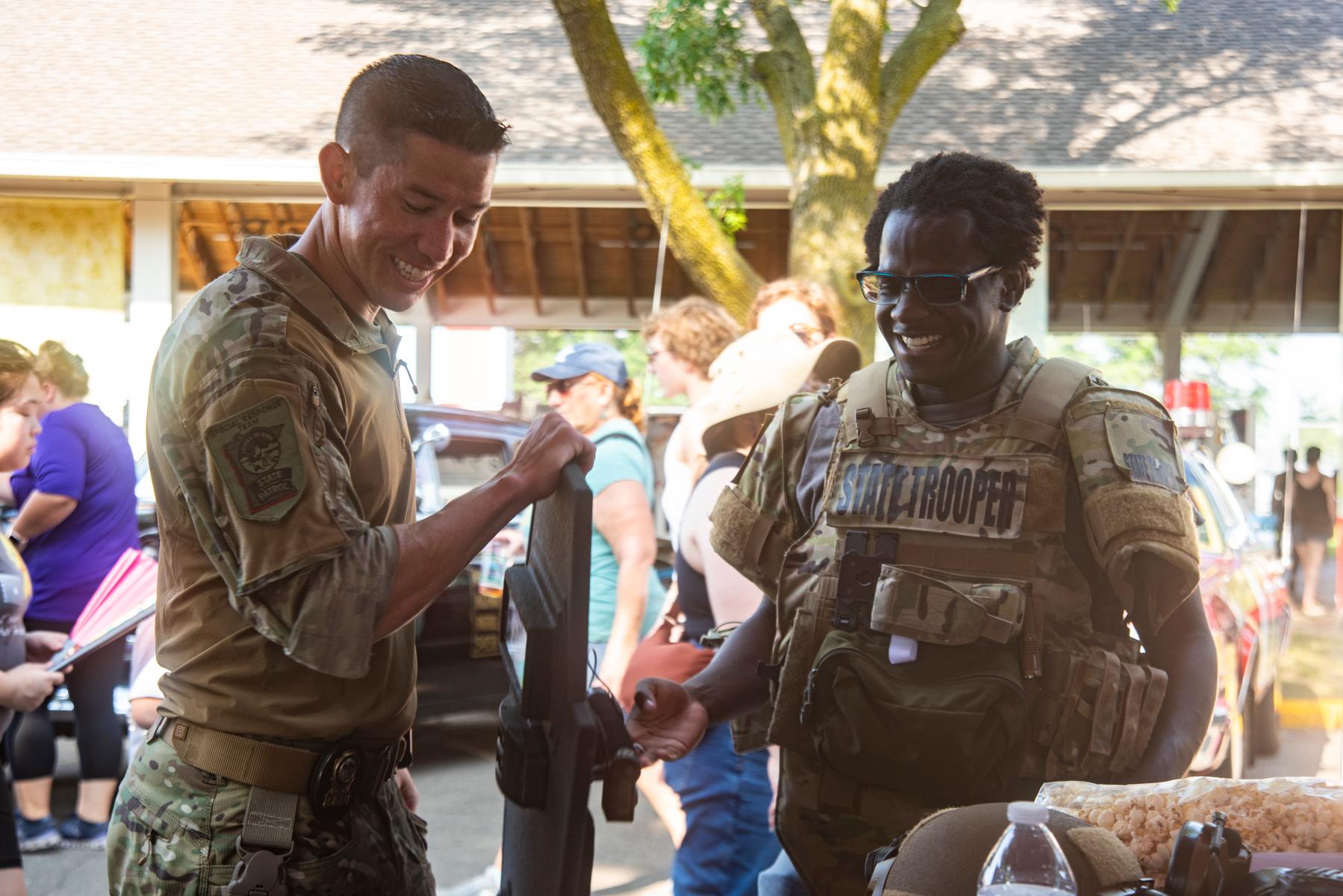 Troopers in special response gear smiling