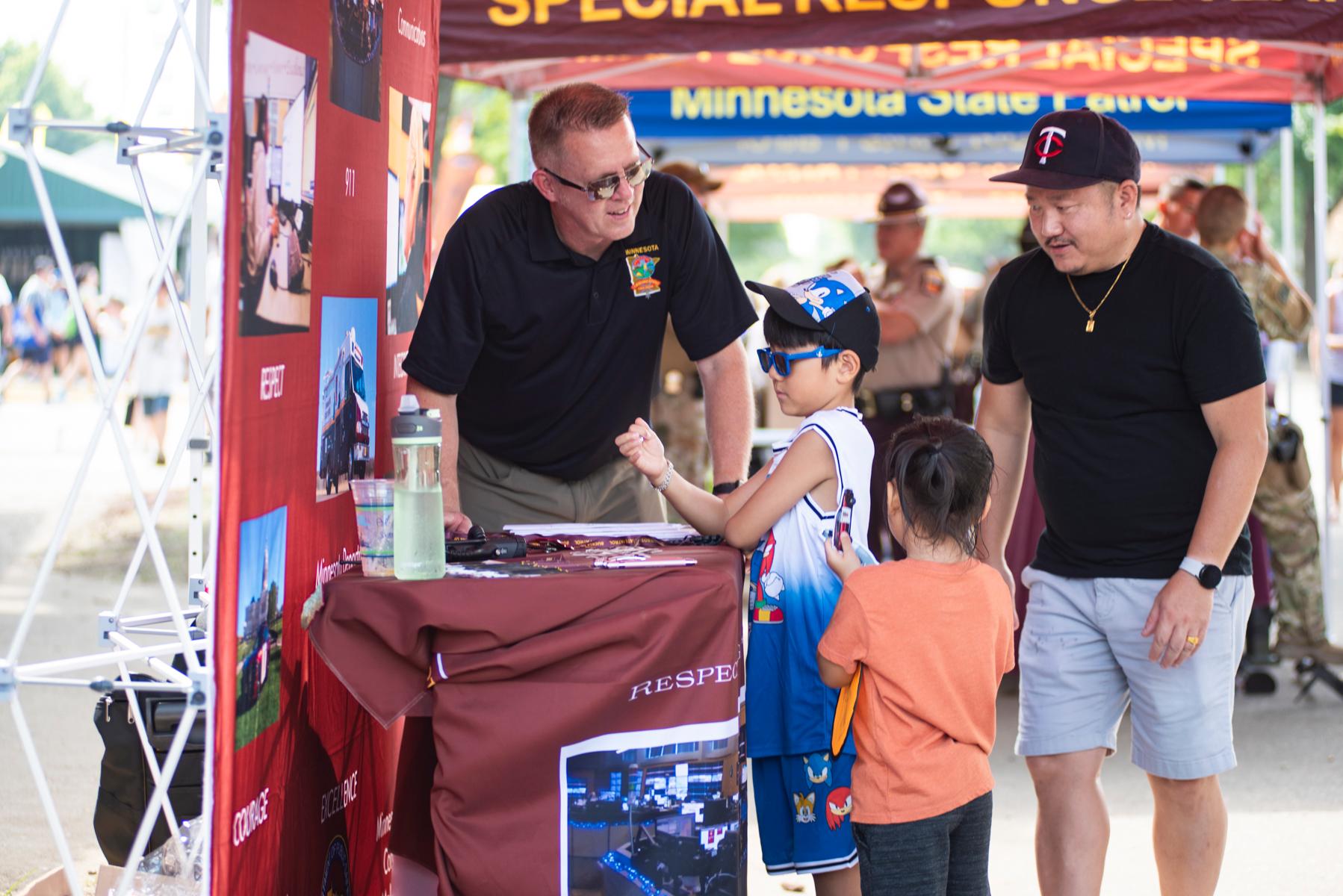 State patrol employee talking to child