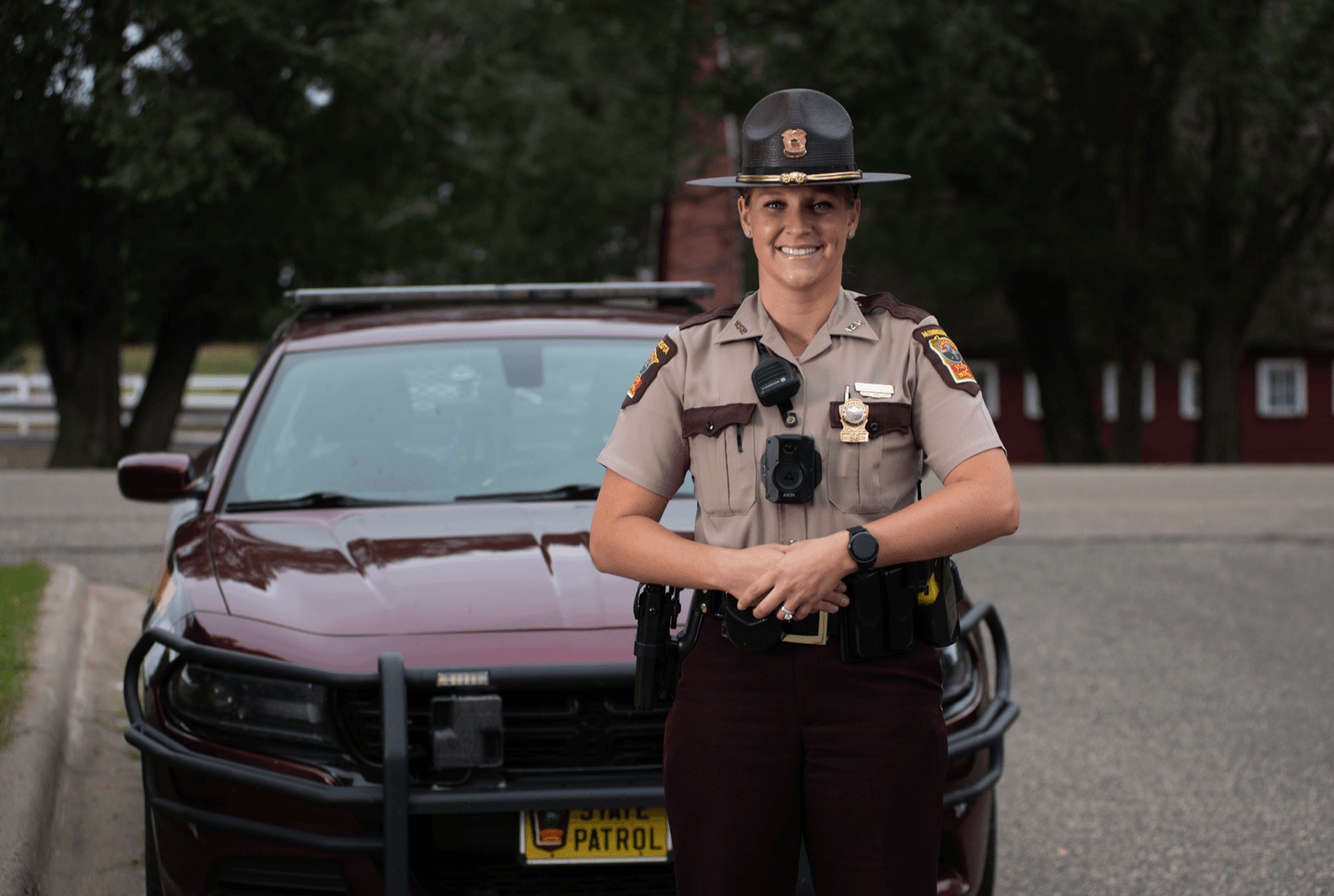 trooper standing in front of squad car