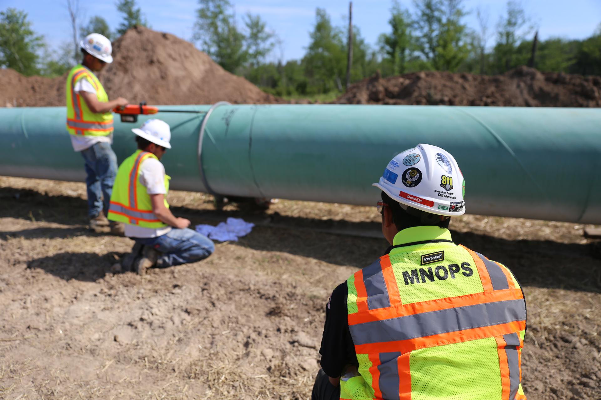 Image of the Office of Pipeline Safety staff inspecting a pipeline installation